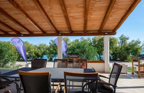 Murter Apartment | Ground floor 6 + 2 P apartment with terrace and sea view, 10 m from the beach