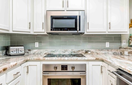 Dauphin Island Condo | Ground-floor condo next to on-site pool with private patio & beach access