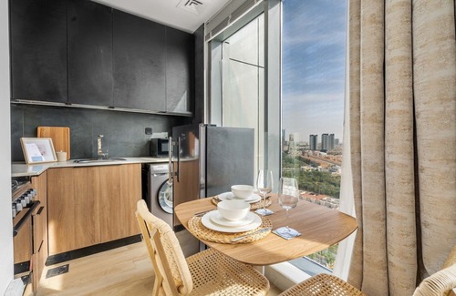 Jumeirah Village Circle Apartment | GuestReady - Arabic Charm | Balcony | Regina Tower