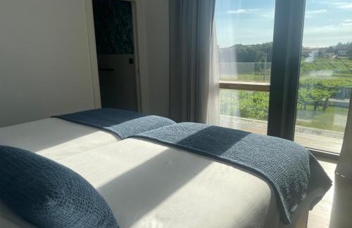 Carracido Hotel | Habitación deluxe rodeada de viñedos