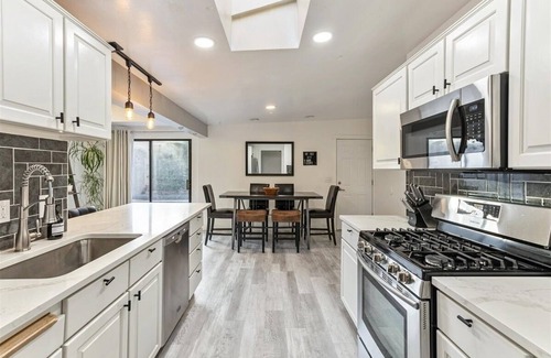 West Valley City House | Heated Pool & Hot Tub open all year with King Beds, Bar & Much More