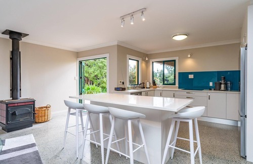 Mangawhai House | Hilltop Retreat - This large home with views in a serene setting is a great spot for your next family retreat