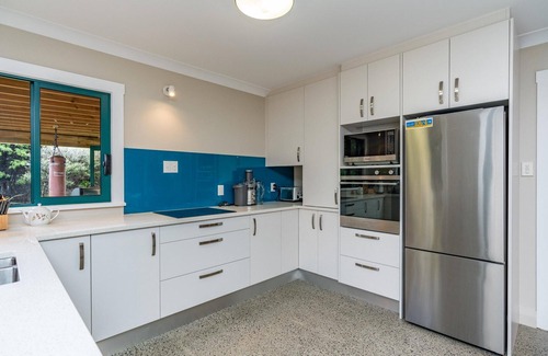 Mangawhai House | Hilltop Retreat - This large home with views in a serene setting is a great spot for your next family retreat