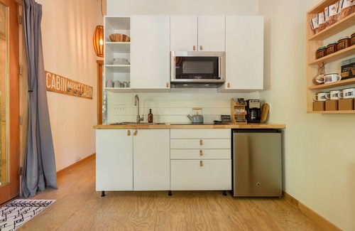 Asheville Cabin | Hip New Scandi cabin + Airstream, hot tub, fire pit, creekside, Uber downtown.