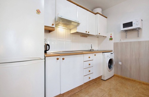 Caleta de Fuste Apartment | Holiday Apartment "Paulalucía" with Mountain View, Shared Pool & Wi-Fi