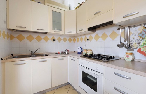 Caorle Apartment | Holiday Apartment "Mansarda Di Ponente" near Beach with Shared Garden & A/C