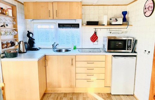 Onderdijk House | Holiday home Balu with own walkway directly on the water IJsselmeer .