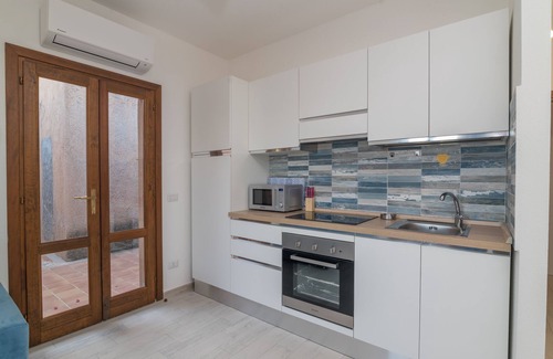 Capo d'Orso House | Holiday Home 'Villetta Porto Mannu E9' with Sea View, Private Terrace and Air Conditioning