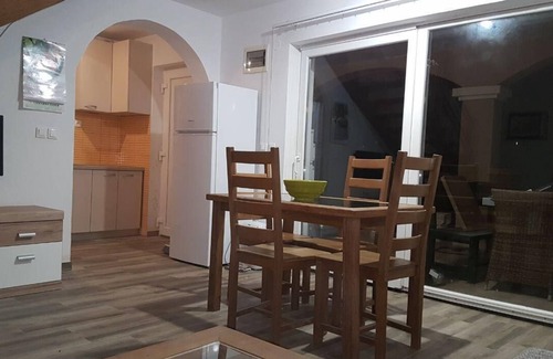 Nin House | House by a river with beds on the gallery