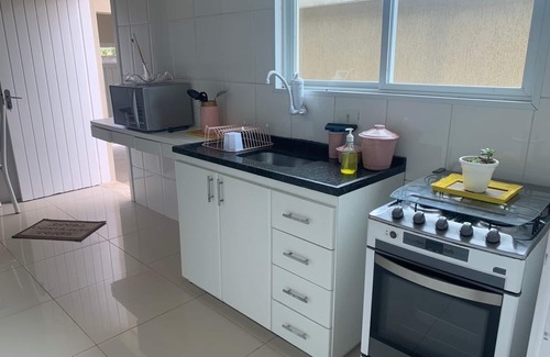 Jardim Virginia House | House in Guarujácwith 3 bedrooms accommodates 10 people very close to the best beach!