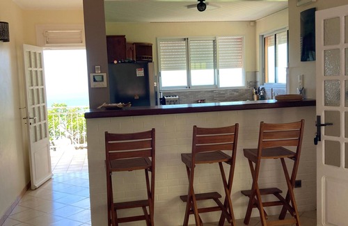 Les Anses-d'Arlets Villa | House with swimming pool with sea view in a garden with trees in Anses d'Arlet