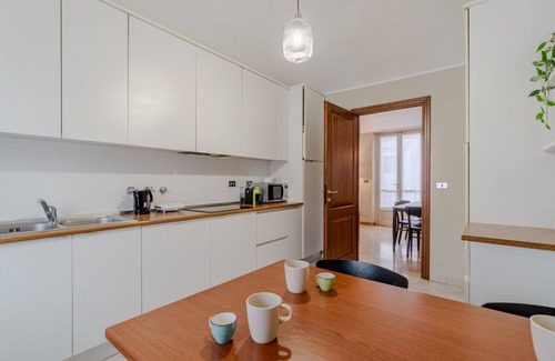 Roman Quarter Apartment | In the heart of the Quadrilatero Romano, this spacious 120 sqm apartment accommodates up to 9 guests. Located on the fourth floor with an elevator (not suitable for disabled people), it features a large terrace perfect for relaxing. The area is lively an