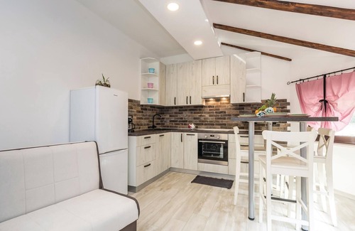 Viskovo Apartment | In Viskovo, a suburb of Rijeka, lies this lovingly and modernly furnished attic apartment.