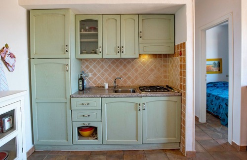 Trinita d'Agultu e Vignola Apartment | Intimate sea-view apartment on the cliff with veranda next to Li Cossi