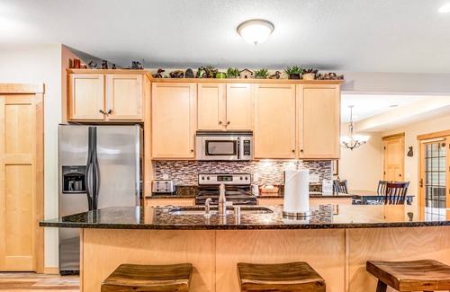 Three Lakes Condo | Lake view condo with 2 balconies, fireplace, pool, hot tubs, gym & sports courts