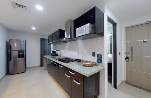 Downtown Cancun Apartment | Lakefront apartment with pool, fitness room, washer/dryer, & patio