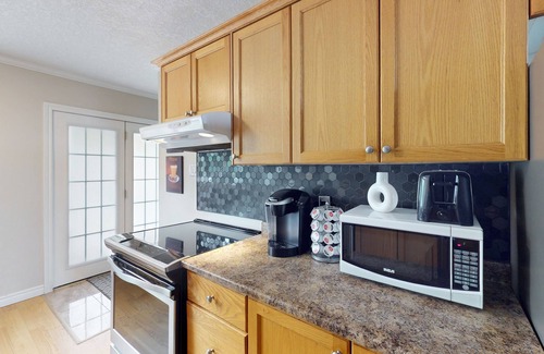 Wasaga Beach House | Lakefront condo steps to the beach with pool, and fireplace