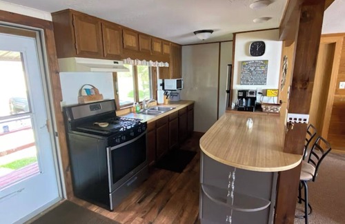 Manistique Cottage | Lakefront getaway on Indian Lake with private dock