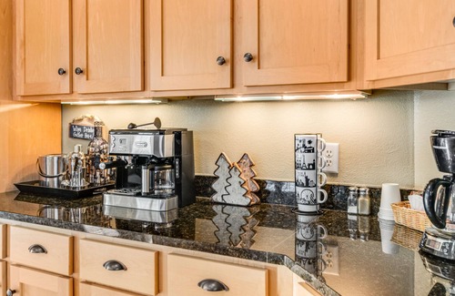 Three Lakes Condo | Lakefront, ground-floor condo with fireplace, patio, private grill & firepit