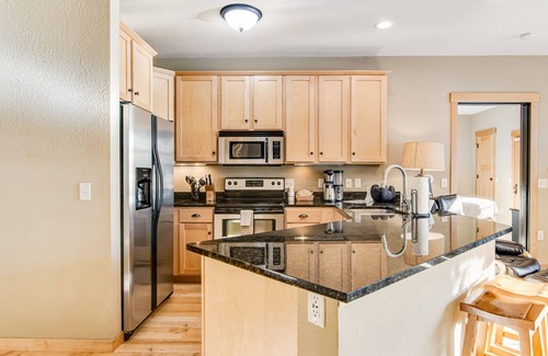 Three Lakes Condo | Lakefront, ground floor condo with indoor pool - fireplace, patio & washer/dryer