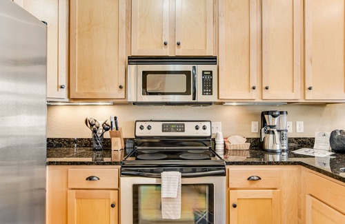 Three Lakes Condo | Lakefront, ground floor condo with indoor pool - fireplace, patio & washer/dryer