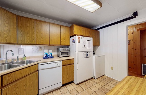 Greenville Junction House | Lakefront Home with Private Dock, Pebble Beach & Enclosed Porch - Dogs Welcome