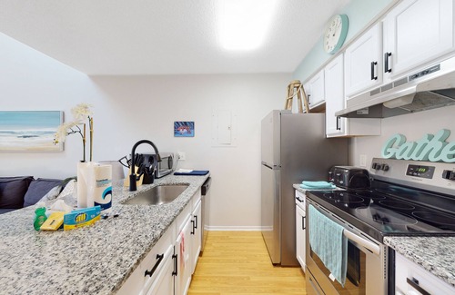 Little River Condo | Loft condo near beach & golf with covered porch, tennis, balcony, & grill