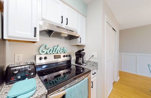 Little River Condo | Loft condo near beach & golf with covered porch, tennis, balcony, & grill