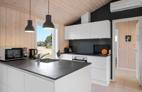 Nykøbing House | Look forward to a fantastic sandy beach near this inviting house with a large terrace.