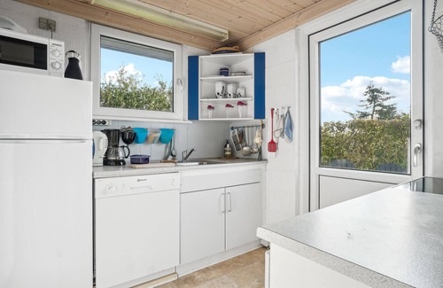 Skyum House | Look forward to a wonderful vacation in this vacation home with green surroundings and sea view.