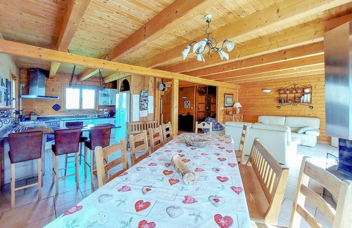 Anould House | Look forward to this large and authentic wooden chalet with an outdoor hot tub.