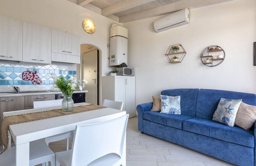 Paduledda Apartment | Lovely apartment for 4 people with A/C, pool, TV, terrace, pets allowed and parking