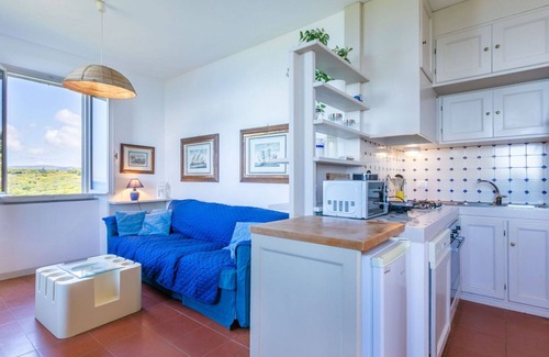 Rosignano Marittimo Apartment | Lovely apartment for 7 people with WIFI, pool, TV and patio