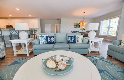 Long Neck House | Lovely home, wraparound porch, waterfront, pools, beach, pet friendly!