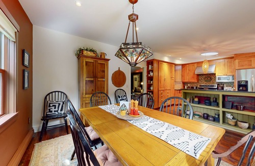 Warren House | Luxe custom home with hot tub, game room, & beautiful garden