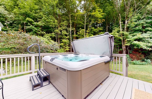 Warren House | Luxe custom home with hot tub, game room, & beautiful garden