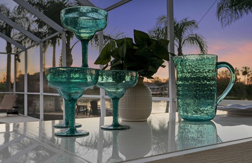 Westchase House | Luxe Waterfront Hideaway w Pool & Pirate Ship Dock