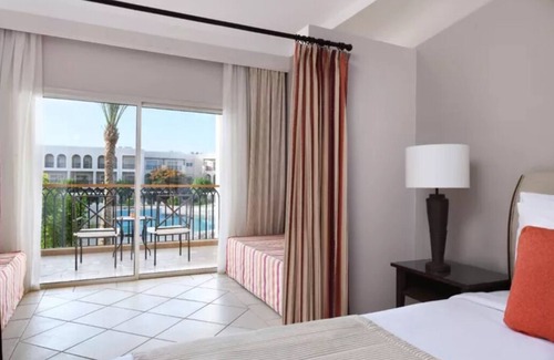 Sharm El Sheikh Hotel | Luxury All‑Inclusive Escape w/12 Pools, Waterslide, Spa, Swim‑Up Bar & Evening