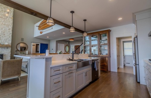 Suttons Bay House | Luxury Lakefront Retreat with Private Beach & Hot Tub