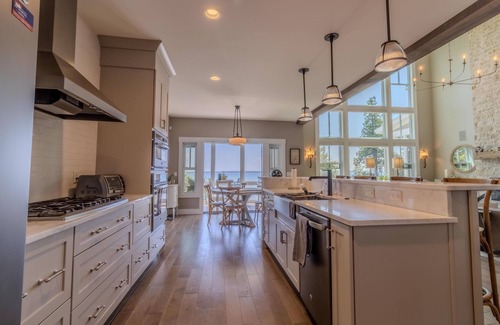 Suttons Bay House | Luxury Lakefront Retreat with Private Beach & Hot Tub