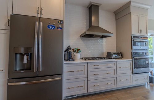 Suttons Bay House | Luxury Lakefront Retreat with Private Beach & Hot Tub