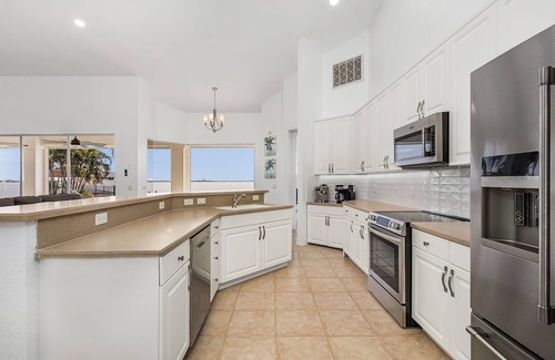 Cape Coral House | Luxury Tropical Oasis on the Caloosahatchee River with Panoramic Southern Views!