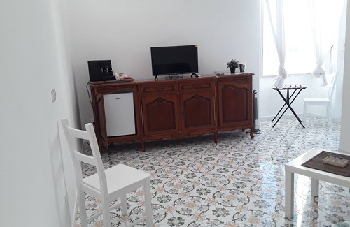 Procida House | MARGIE HOUSE SEAVIEW ROOM Quadruple room with a sea view of Procida harbor.