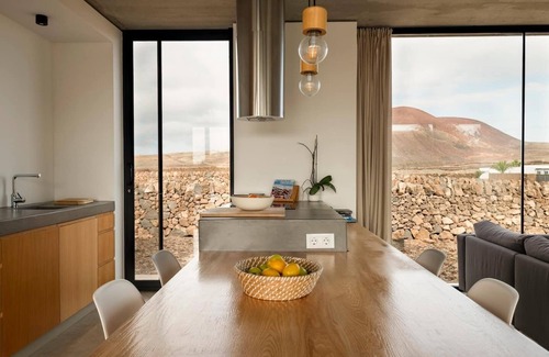 Lajares House | Minimalist house with heated pool and great volcano view