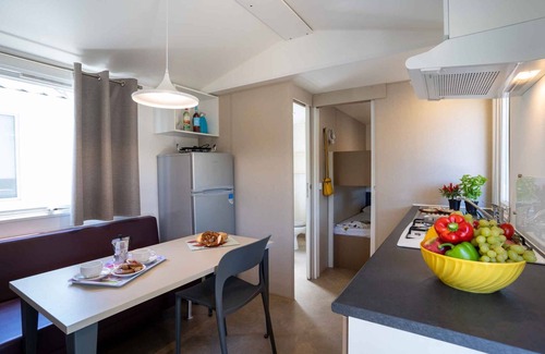 Mandrione House | Mobilehome with half-imagined wooden terrace