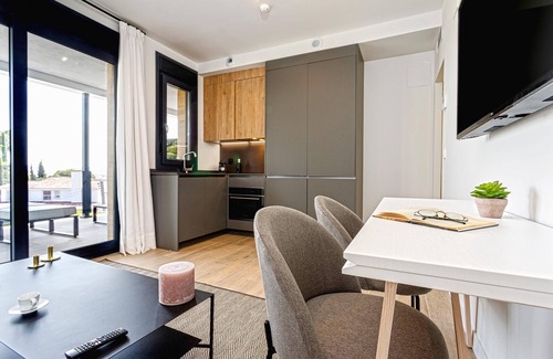 Distrito Norte Sierra Apartment | Modern 1BD apartment with terrace, pool & parking. Arruzafa V