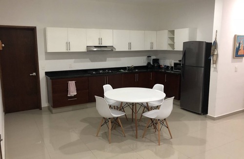 Zona Dorada Condo | Modern Apt 1st level with rooftop 5 min from the beach. (WiFi,Cable,AC,Boiler)