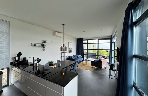 Enkhuizen House | Modern chalet with exceptional sea views, fenced garden and direct beach access