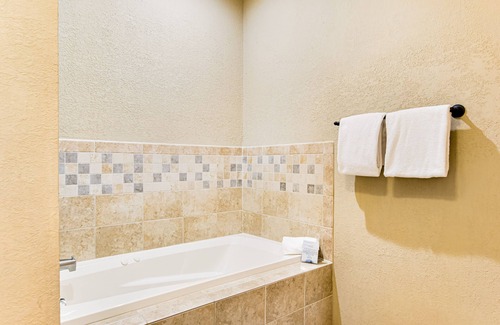 Three Lakes Condo | Modern, lake-view condo with loft, balcony, fireplace, pool & hot tub access