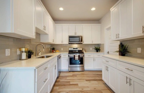 East MLK House | Modern Luxury Home | Shared Pool